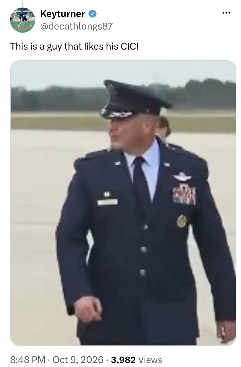 Tweet by Keyturner (@decathlongs87) with the message: "This is a guy that likes his CIC!" The image shows a man in a military uniform with medals, looking to the side. He is outdoors on what appears to be an airfield. The tweet was posted at 8:48 PM on Oct 9, 2026, and has 3,982 views.